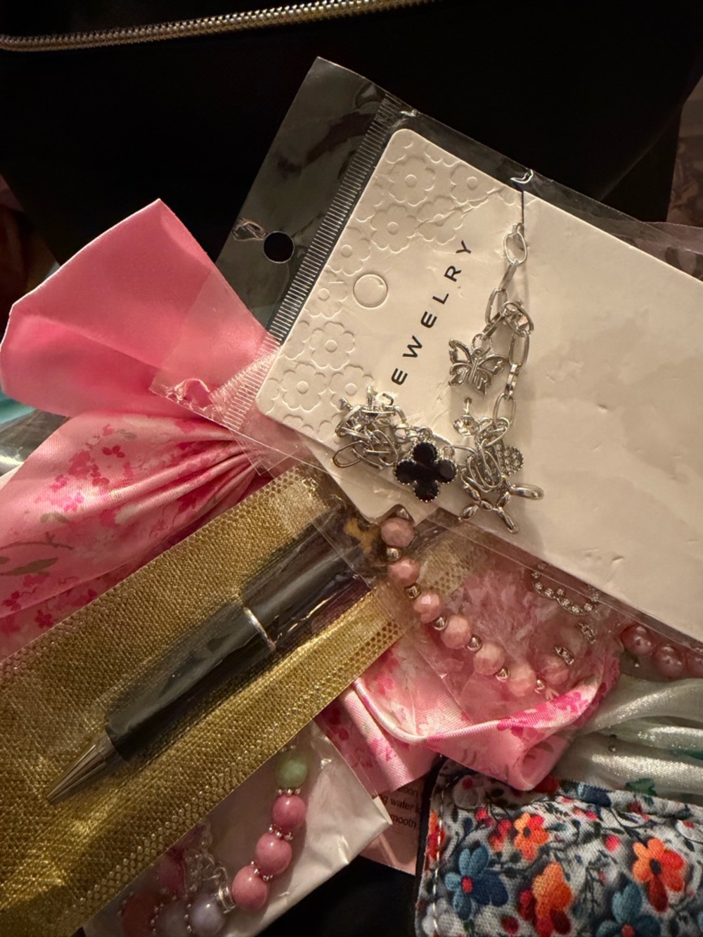 Black cosmetic bag filled full of goodies for that special mother